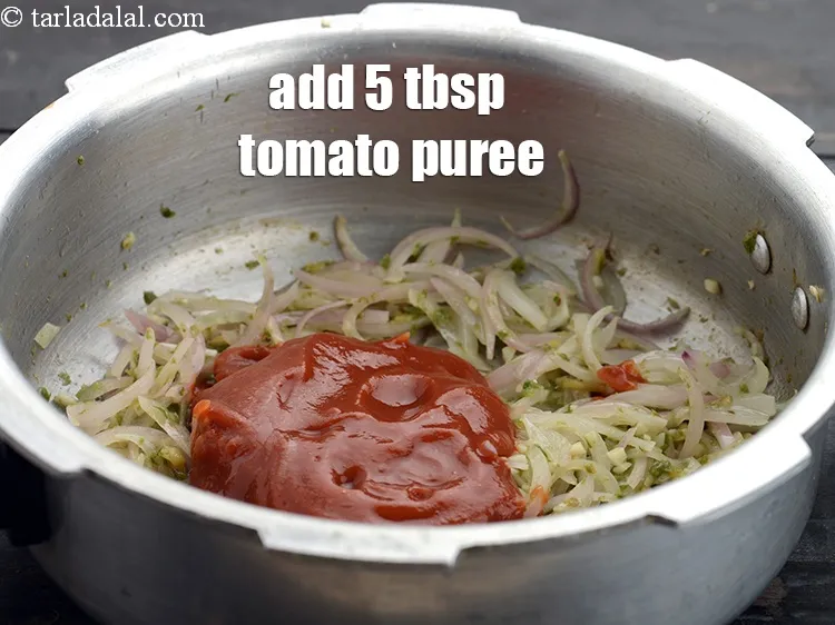 Step 17 – Add 5 tbsp&nbsp;<a href="https://www.tarladalal.com/glossary-tomato-puree-tamatar-ki-puree-487i">tomato puree</a>.