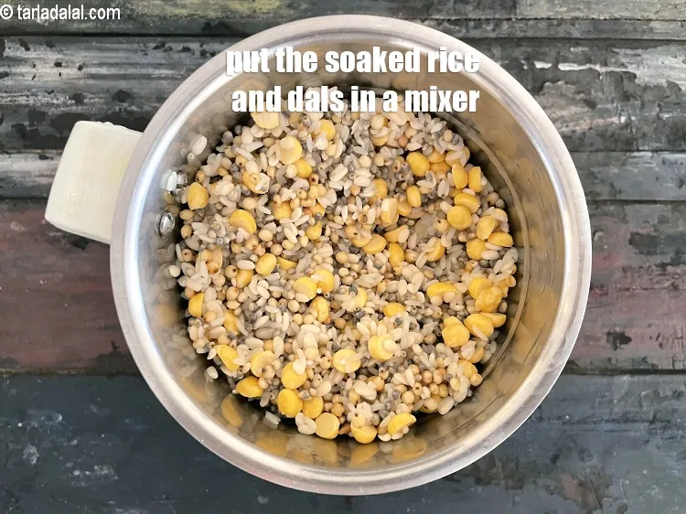 Step 14 – Put the soaked and drained&nbsp;dal and rice in a mixer.