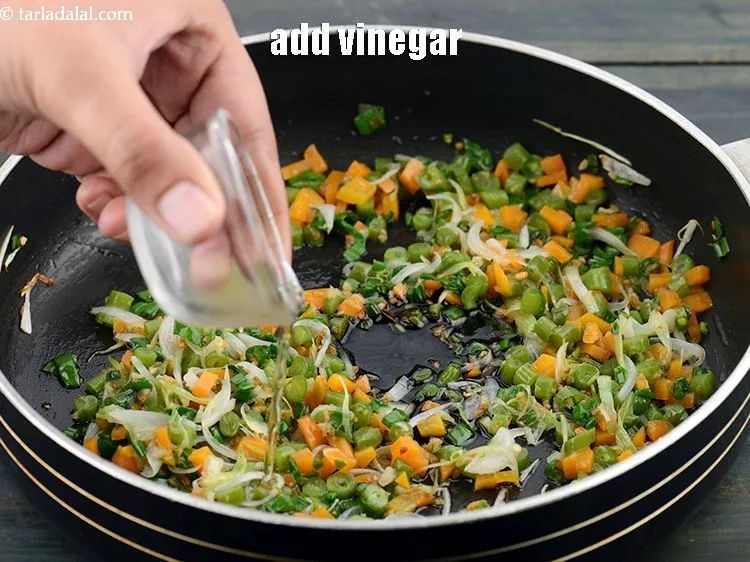 Step 24 – Add 1 tsp&nbsp;<a href="https://www.tarladalal.com/glossary-vinegar-sirka-cooking-vinegar-341i">vinegar</a>.&nbsp;