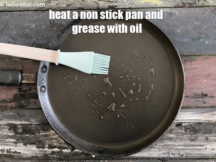Step 16 – Heat a non stick pan and grease with oil.