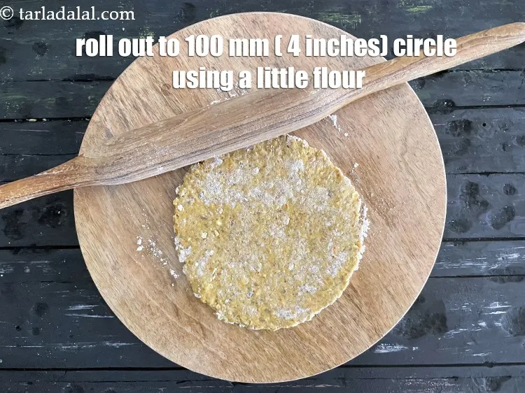 Step 17 – Roll a portion of the dough into 100 mm. (4&quot;) diameter circle using a little …