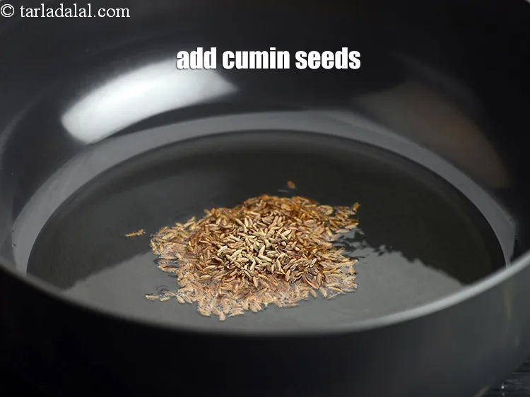 Step 15 – When hot add 1 tsp&nbsp;<a href="https://www.tarladalal.com/glossary-cumin-seeds-jeera-zeera-381i">cumin seeds (jeera)</a>.
