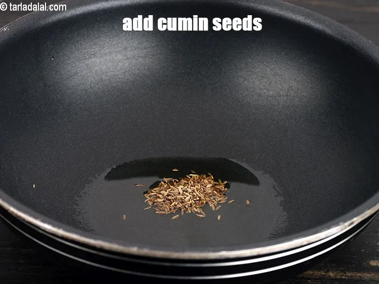 Step 14 – Add &frac12; tsp <a href="https://www.tarladalal.com/glossary-cumin-seeds-jeera-zeera-381i">cumin seeds (jeera)</a>.