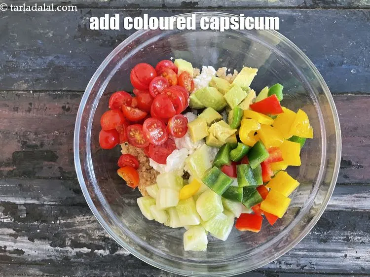 Step 22 – Add&nbsp;1/2 cup&nbsp;<a href="https://tarladalal.com/glossary-capsicum-cubes-170i">capsicum cubes</a>&nbsp;(red , yellow and green).
