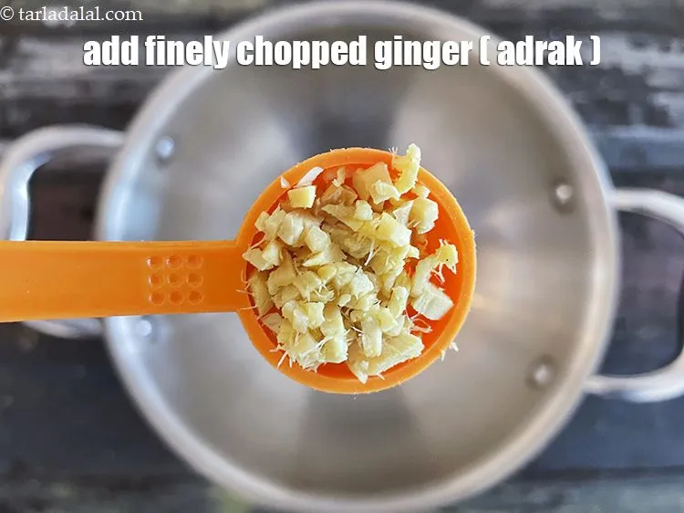 Step 23 – Add&nbsp;1 tsp&nbsp;finely&nbsp;<a href="glossary-chopped-ginger-786i">chopped ginger (adrak)</a>.