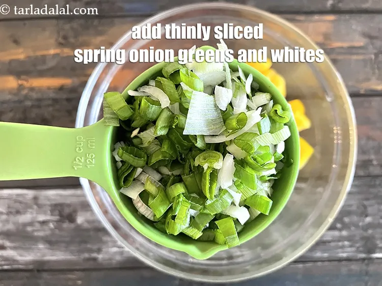 Step 16 – Add&nbsp;<meta charset="UTF-8" />1/2 cup&nbsp;thinly&nbsp;<a href="glossary-sliced-spring-onions-1576i">sliced spring onion</a>&nbsp;(whites and greens).
