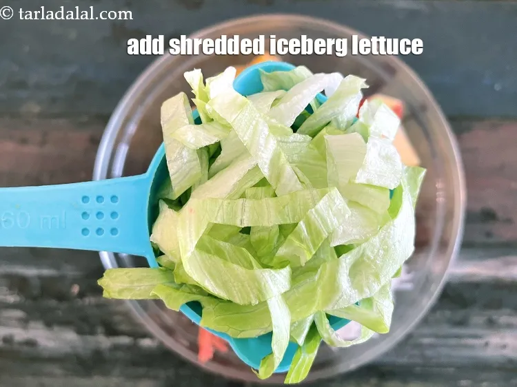 Step 27 – Add&nbsp;<meta charset="UTF-8" />1/2 cup&nbsp;<a href="glossary-shredded-iceberg-lettuce-2188i">shredded iceberg lettuce</a>.