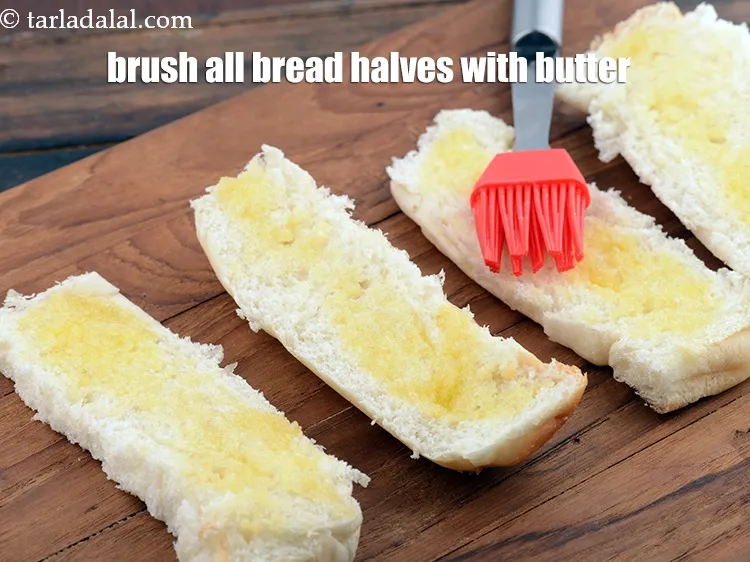 Step 15 – Brush all the bread halves with a little <a href="https://www.tarladalal.com/glossary-melted-butter-1941i">melted butter</a>&nbsp;for brushing.&nbsp;