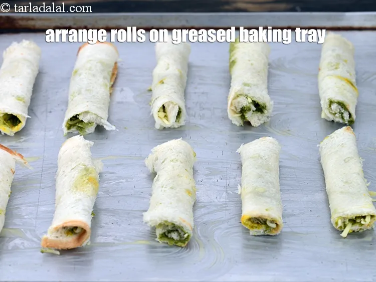 Step 14 – Arrange the rolls on a lightly greased baking tray.