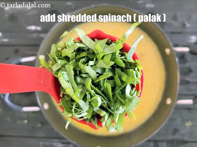 Step 15 – Add&nbsp;<meta charset="UTF-8" />1/4 cup&nbsp;<a href="glossary-shredded-spinach-777i">shredded spinach (palak)</a>.