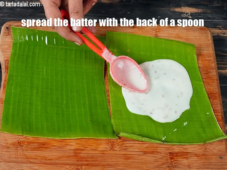 Step 17 – <meta charset="UTF-8" /> Spread the batter with the back of a spoon on the banana …