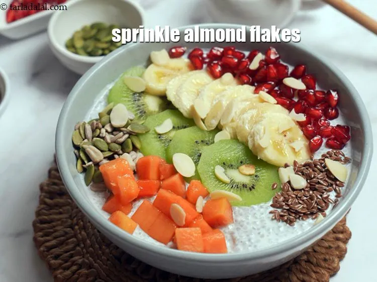 Step 14 – Sprinkle some <a href="https://www.tarladalal.com/glossary-almond-flakes-2028i">almond (badam) flakes</a> over it.