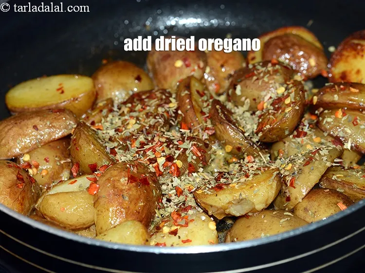 Step 15 – Add 1 tsp <a href="https://www.tarladalal.com/glossary-dried-oregano-268i">dried oregano</a>.