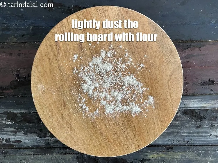 Step 15 – Lightly dust the rolling board using little whole wheat flour.