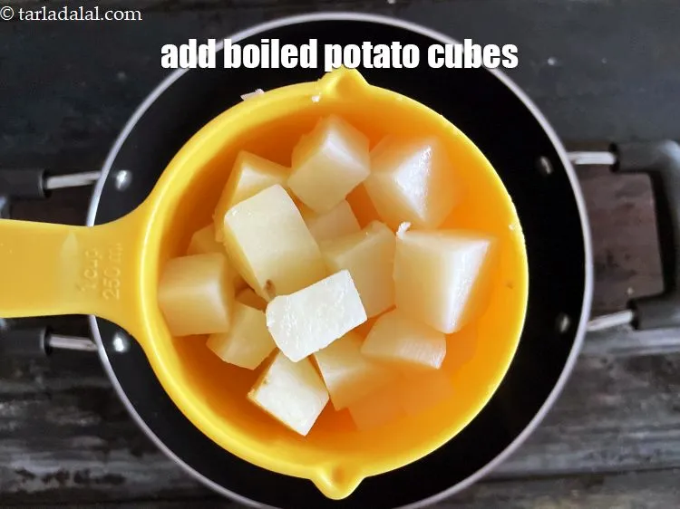Step 14 – Add&nbsp;<meta charset="UTF-8" />3/4 cup&nbsp;<a href="glossary-boiled-potato-cubes-2312i">boiled potato cubes</a>.