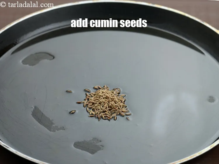 Step 14 – Add &frac12; tsp <a href="https://tarladalal.com/glossary-cumin-seeds-jeera-zeera-381i">cumin seeds (jeera)</a>.