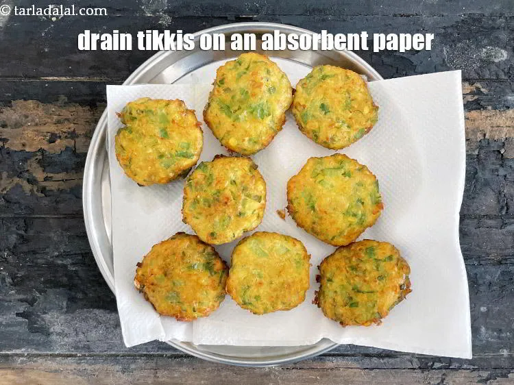 Step 25 – Drain tikkis on an absorbent paper to remove&nbsp;the excess oil.