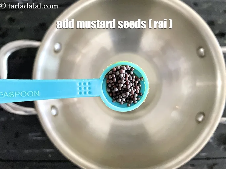 Step 14 – Add 1/2 tsp&nbsp;<a href="https://www.tarladalal.com/glossary-mustard-seeds-sarson-rai-sarson-ke-beej-525i">mustard seeds ( rai / sarson)</a>