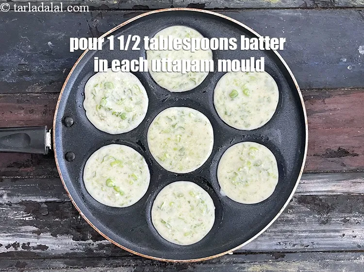 Step 26 – Pour a 1 1/2 tablespoons of the batter in each uttapa mould to make a …