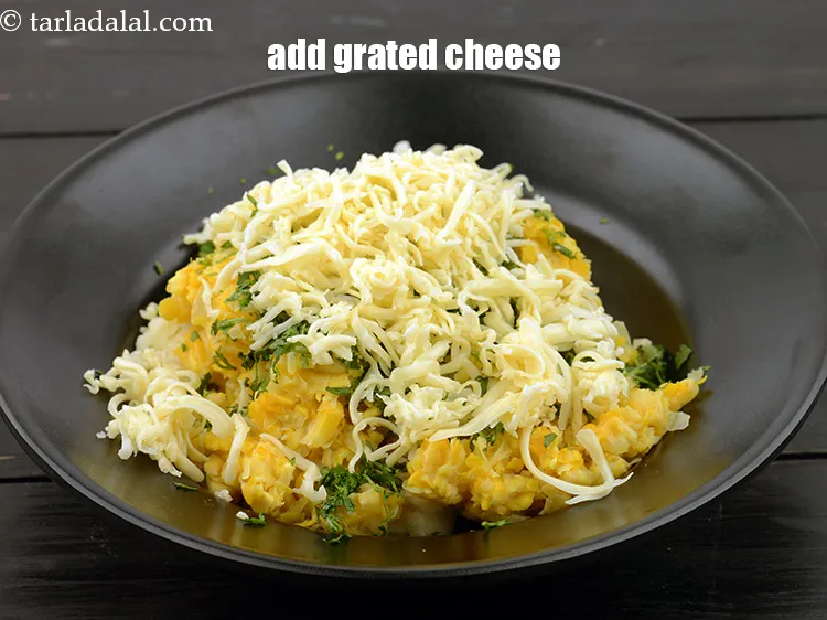 Step 15 – Add 5 tbsp&nbsp;<a href="https://www.tarladalal.com/glossary-grated-processed-cheese-868i">grated processed cheese</a>.&nbsp;