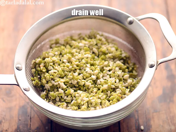 Step 23 – To make <strong>chawli moong dal appe recipe&nbsp;|&nbsp;chaulai appe&nbsp;|&nbsp;healthy appe&nbsp;|&nbsp;amaranth leaves appe</strong>, after 2 hours, drain …