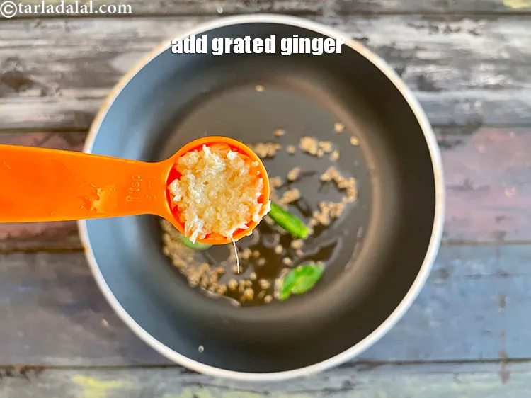 Step 15 – <html><head></head><body><p>Add&nbsp;1 tsp&nbsp; <a href="glossary-grated-ginger-943i">grated ginger (adrak)</a>.</p></body></html>