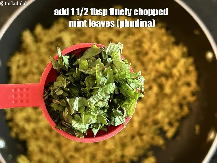 Step 27 – Add 2 tbsp&nbsp;finely&nbsp;<a href="glossary-chopped-mint-788i">chopped mint leaves (phudina)</a>.