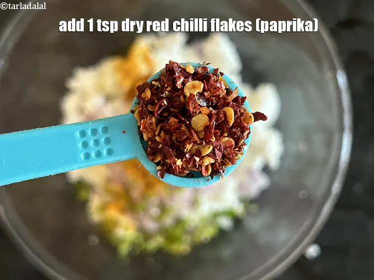 Step 15 – Add&nbsp;1 tsp&nbsp;<a href="https://www.tarladalal.com/glossary-dry-red-chilli-flakes-paprika-338i">dry red chilli flakes (paprika)</a>.