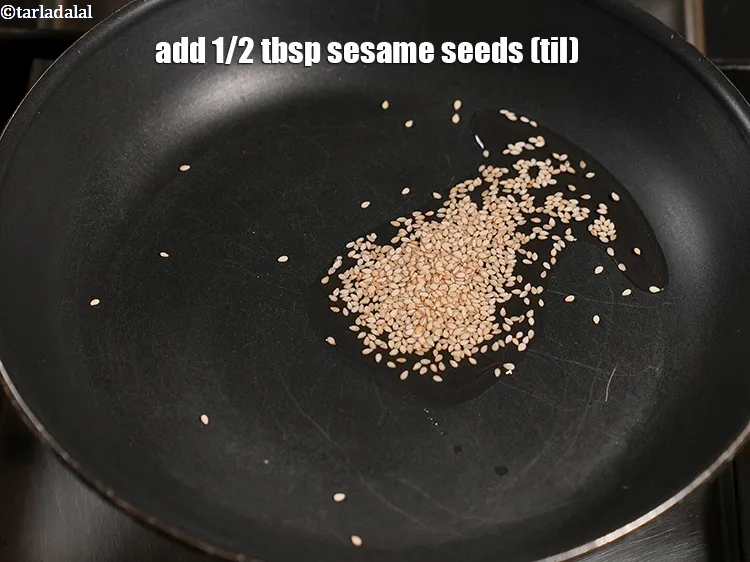 Step 15 – Add&nbsp;1/2 tbsp&nbsp;<a href="https://www.tarladalal.com/glossary-sesame-seeds-til-gingelly-seeds-612i">sesame seeds (til)</a>.