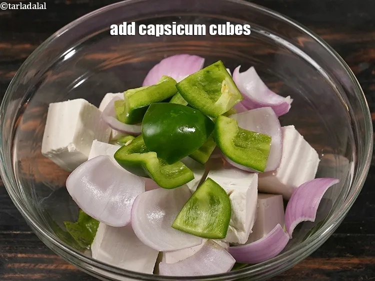 Step 15 – Add&nbsp;1/2&nbsp;cup&nbsp;<a href="https://www.tarladalal.com/glossary-capsicum-cubes-170i">capsicum cubes</a>.