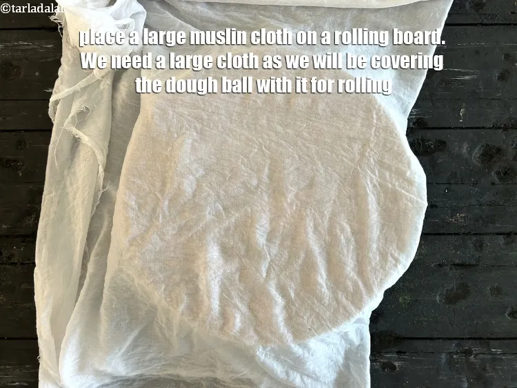 Step 15 – Place a large moist muslin cloth on a rolling board. We need a large cloth …
