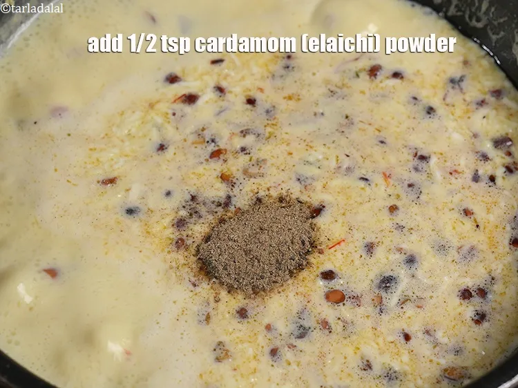 Step 16 – Add 1/2 tsp <a href="https://www.tarladalal.com/glossary-cardamom-powder-elaichi-powder-265i">cardamom (elaichi) powder</a>.