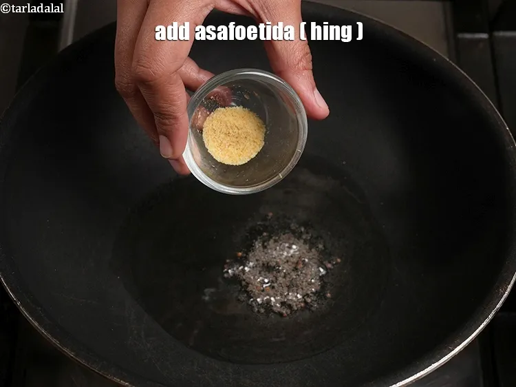 Step 16 – When the seeds crackle, add 1/4 tsp&nbsp;<a href="https://www.tarladalal.com/glossary-asafoetida-hing-113i">asafoetida (hing)</a>.