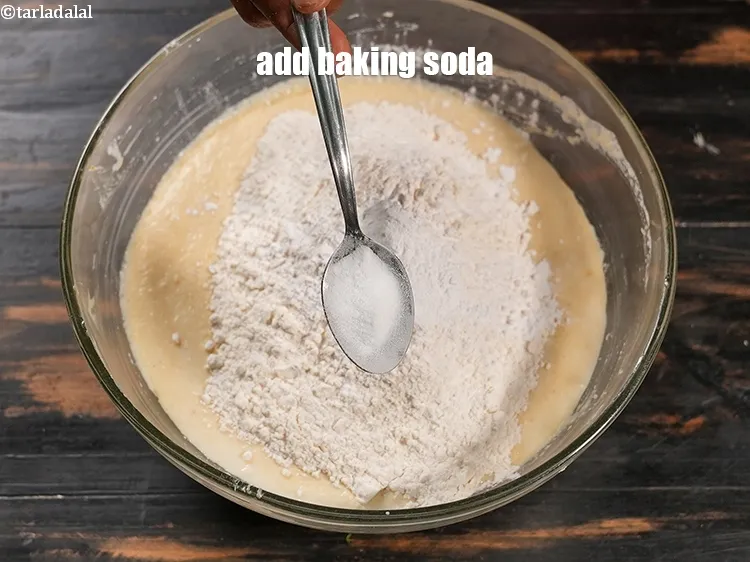 Step 15 – Add &frac14; tsp <a href="https://www.tarladalal.com/glossary-baking-soda-soda-bi-carb-615i">baking soda</a>.