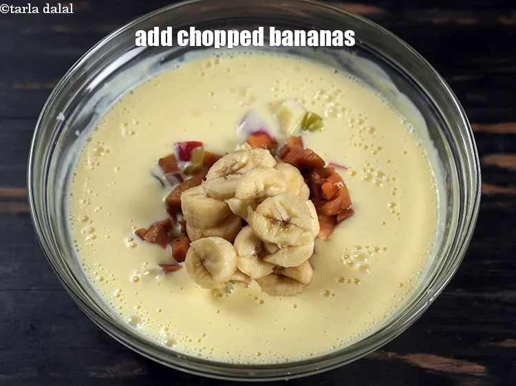 Step 15 – Add &frac12; cup <a href="https://www.tarladalal.com/glossary-chopped-bananas-20i">chopped bananas</a>.