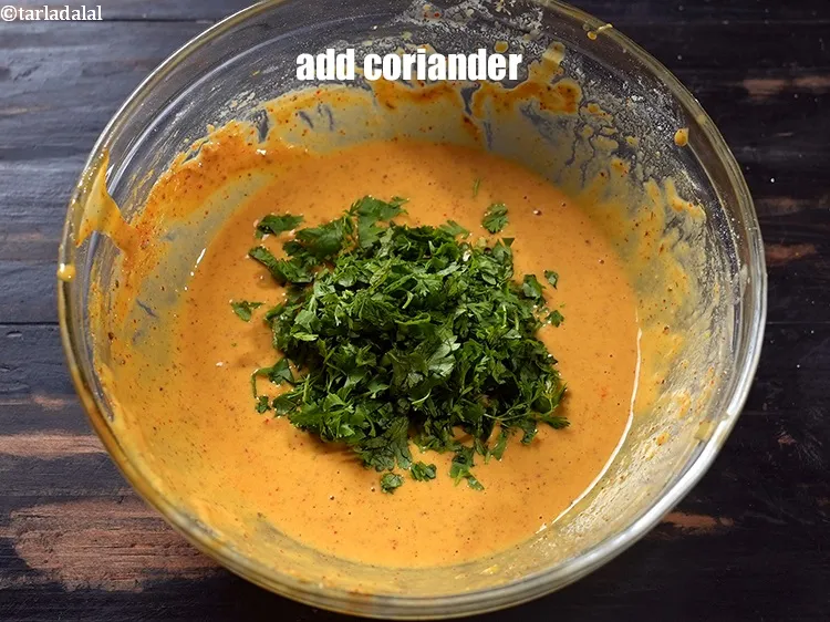 Step 15 – Add 2 tbsp finely <a href="https://www.tarladalal.com/glossary-chopped-coriander-783i">chopped coriander (dhania)</a>.