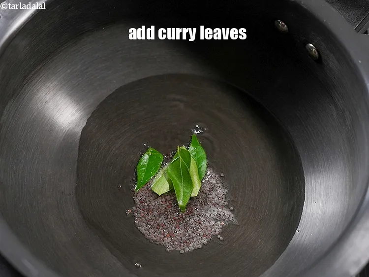 Step 15 – Add 7 to 8 <a href="https://www.tarladalal.com/glossary-curry-leaves-kadi-patta-kadipatta-388i">curry leaves (kadi patta)</a>.