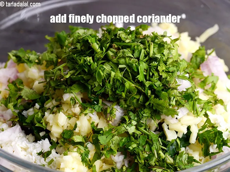 Step 17 – Add 2 tbsp finely&nbsp;<a href="https://www.tarladalal.com/glossary-chopped-coriander-783i">chopped coriander (dhania)</a>
