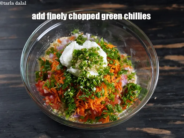 Step 15 – Add 2 tsp finely&nbsp;<a href="https://www.tarladalal.com/glossary-chopped-green-chilli-820i">chopped green chillies</a>.