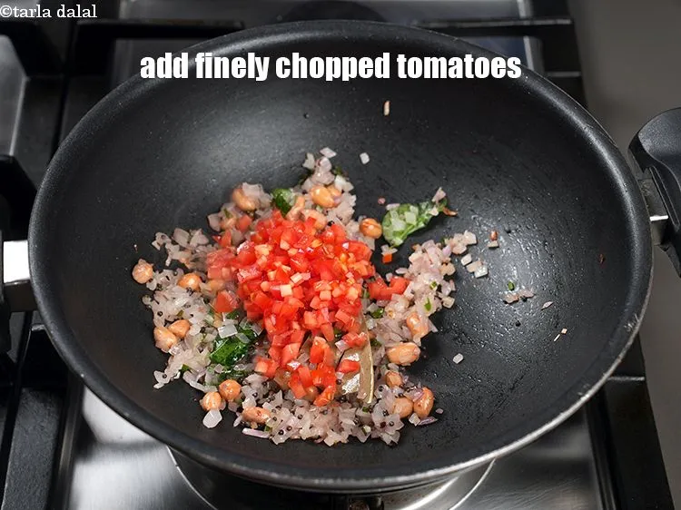 Step 15 – Add &frac12; cup finely <a href="https://www.tarladalal.com/glossary-chopped-tomatoes-779i">chopped tomatoes</a>.