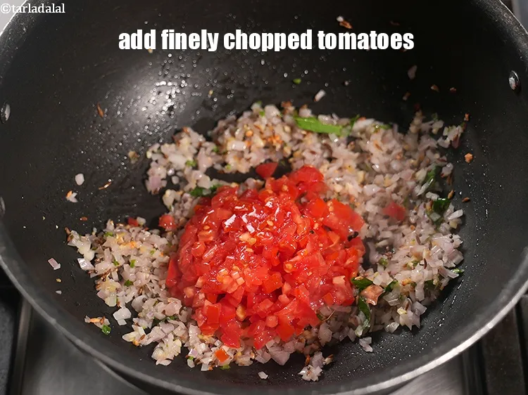 Step 15 – Add &frac12; cup finely <a href="https://www.tarladalal.com/glossary-chopped-tomatoes-779i">chopped tomatoes</a>.