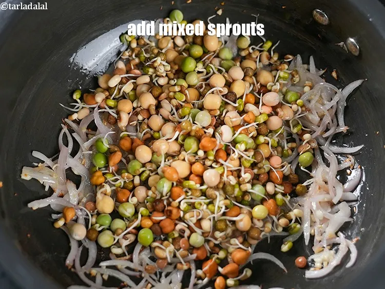 Step 15 – Add 1 cup <a href="https://www.tarladalal.com/glossary-mixed-sprouts-195i">mixed sprouts</a>.