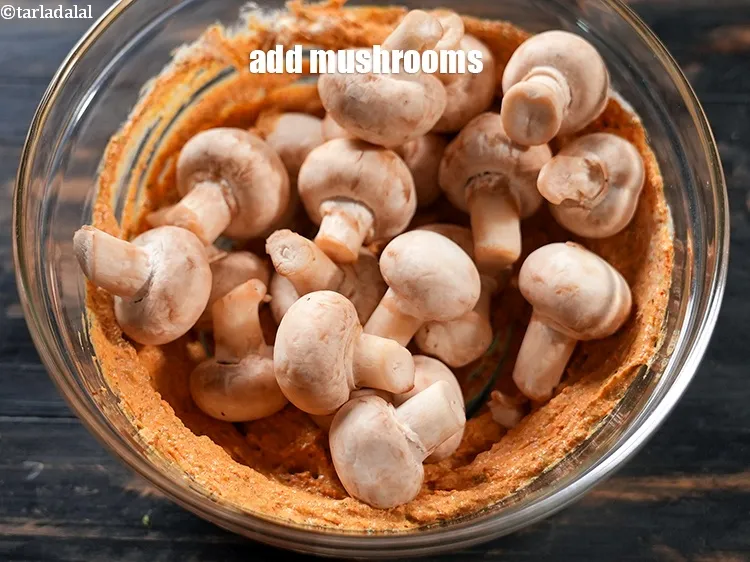 Step 15 – Add 4 cups <a href="https://www.tarladalal.com/glossary-mushrooms-khumb-dhingri-493i">mushrooms (khumb)</a>.