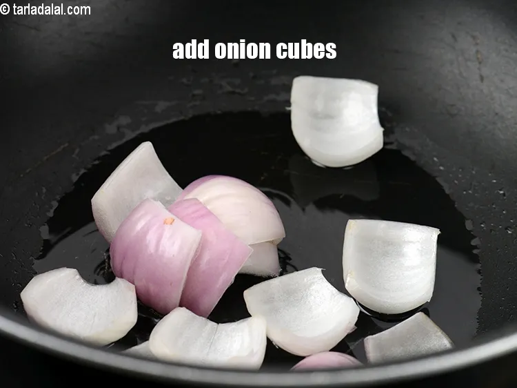 Step 16 – Add &frac12; cup&nbsp;<a href="https://www.tarladalal.com/glossary-onion-cubes-732i">onion cubes</a>.