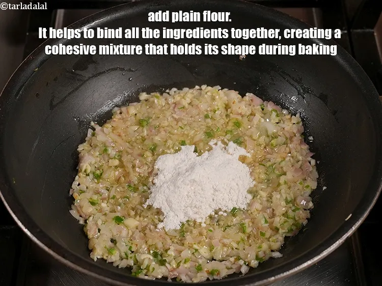Step 15 – Add 2 tbsp <a href="https://www.tarladalal.com/glossary-plain-flour-maida-188i">plain flour (maida)</a>. It helps to bind all the ingredients together, …