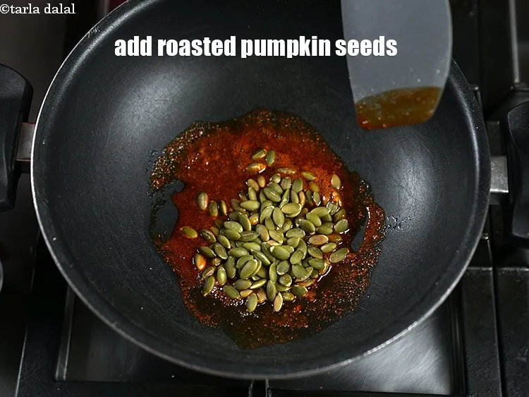 Step 15 – Add 2 tbsp <a href="https://www.tarladalal.com/glossary-roasted-pumpkin-seeds-2699i">roasted pumpkin seeds</a>.