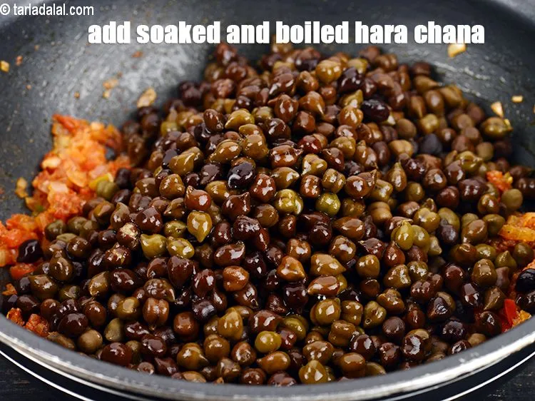 Step 15 – Add &frac12; cup soaked and boiled&nbsp;<a href="https://www.tarladalal.com/glossary-hara-chana-green-chick-peas-289i">hara chana (green chick peas)</a>.&nbsp;