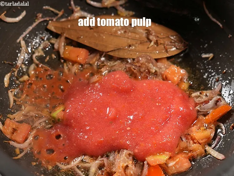 Step 15 – Add &frac12; cup <a href="https://www.tarladalal.com/glossary-tomato-pulp-tamatar-ka-pulp-1039i">tomato pulp</a>.