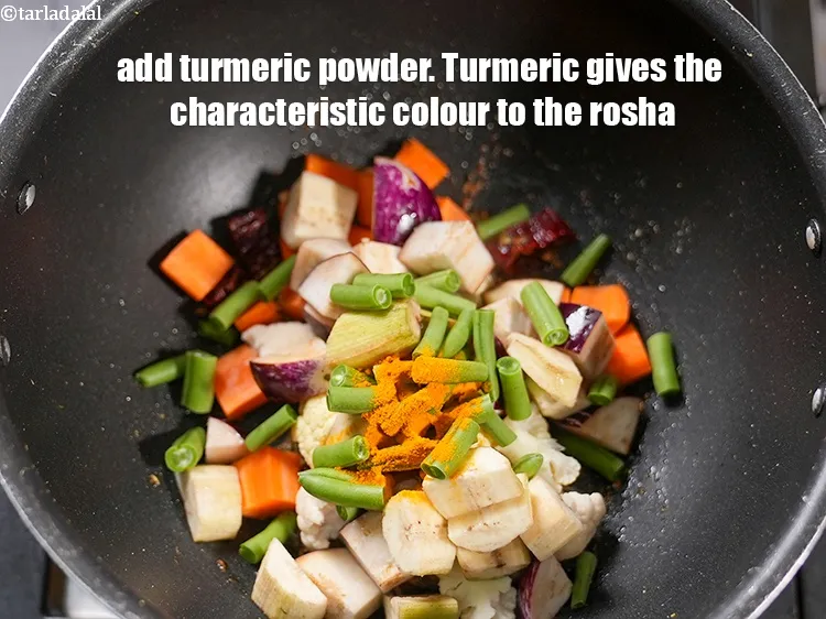 Step 15 – Add &frac12; tsp <a href="https://www.tarladalal.com/glossary-turmeric-powder-haldi-645i">turmeric powder (haldi)</a>. Turmeric gives the characteristic colour to the rosha.
