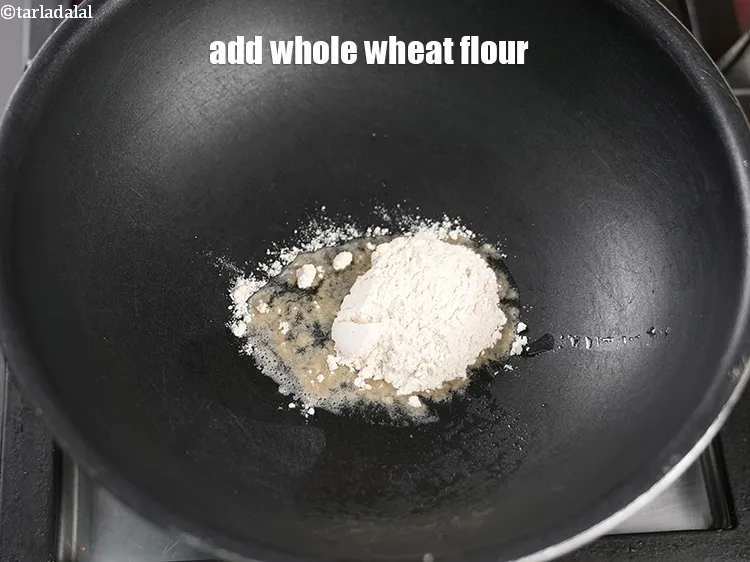 Step 17 – Add 1 tbsp <a href="https://www.tarladalal.com/glossary-whole-wheat-flour-gehun-ka-atta-gehun-ka-aata-429i">whole wheat flour (gehun ka atta)</a>.